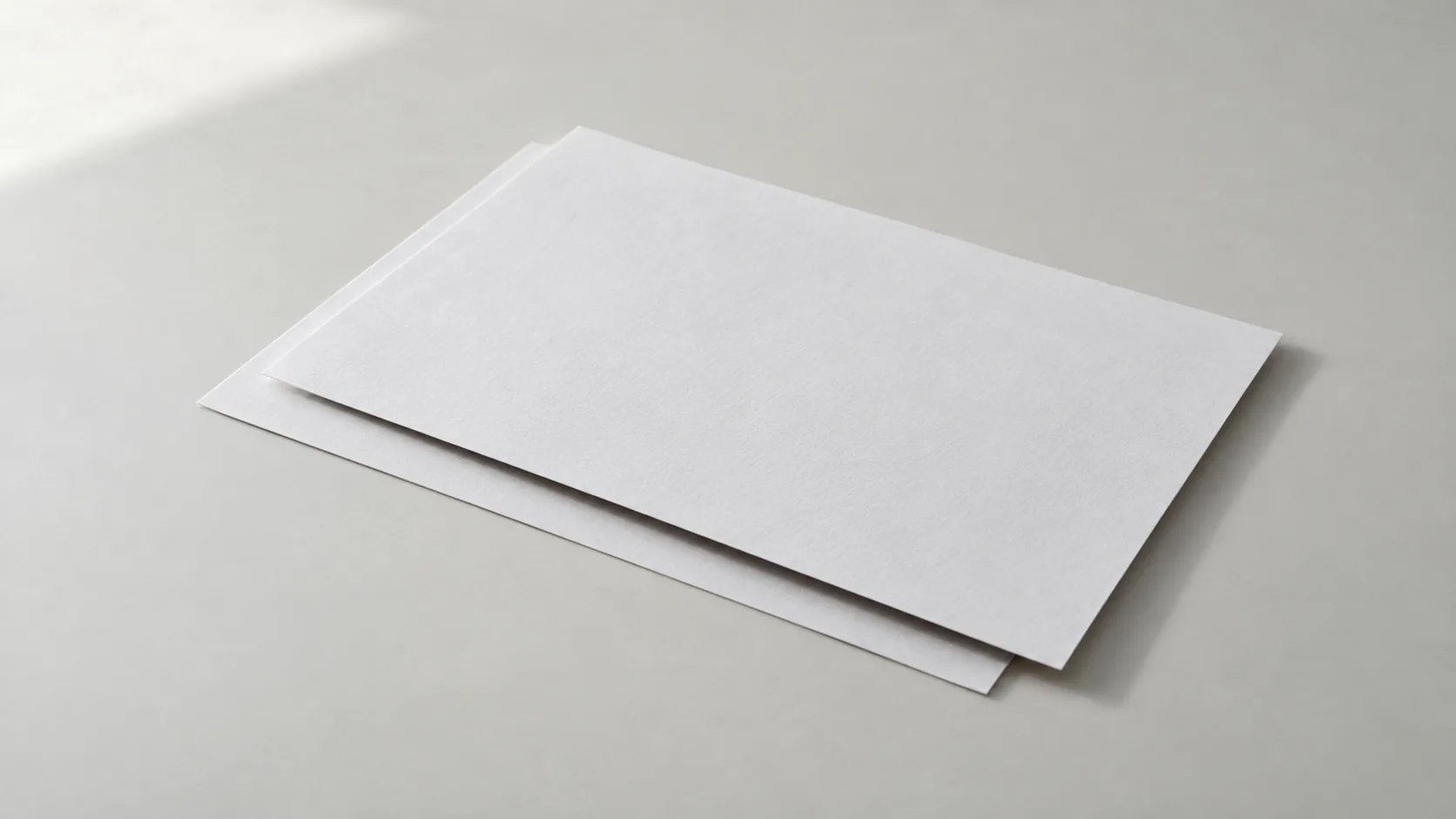 Two copies of the same document laid one over the other and shifted out of alignment, illustrating how terms drift between the letter of intent and the definitive purchase agreement